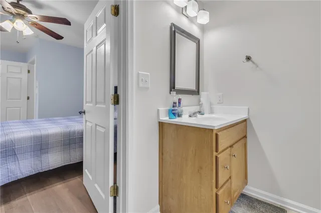 a bathroom with a toilet and a shower curtain