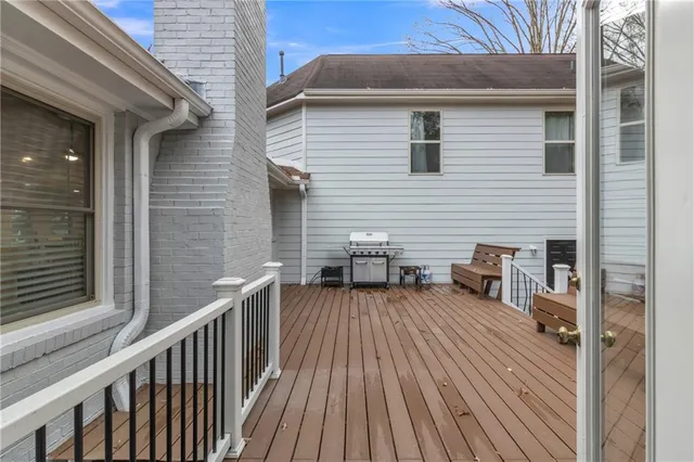 a view of a dry yard with large trees
