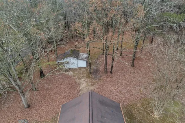 a backyard of apartments with large trees