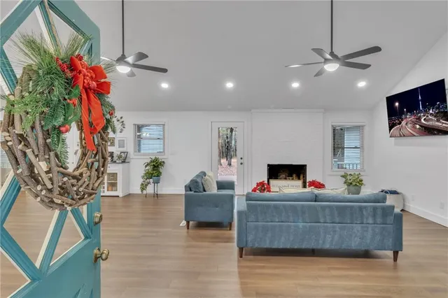 a living room with furniture and a fireplace