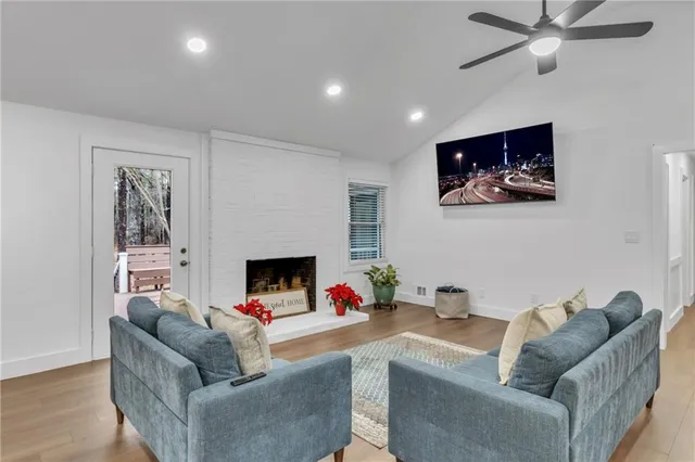 a living room with furniture and flowers