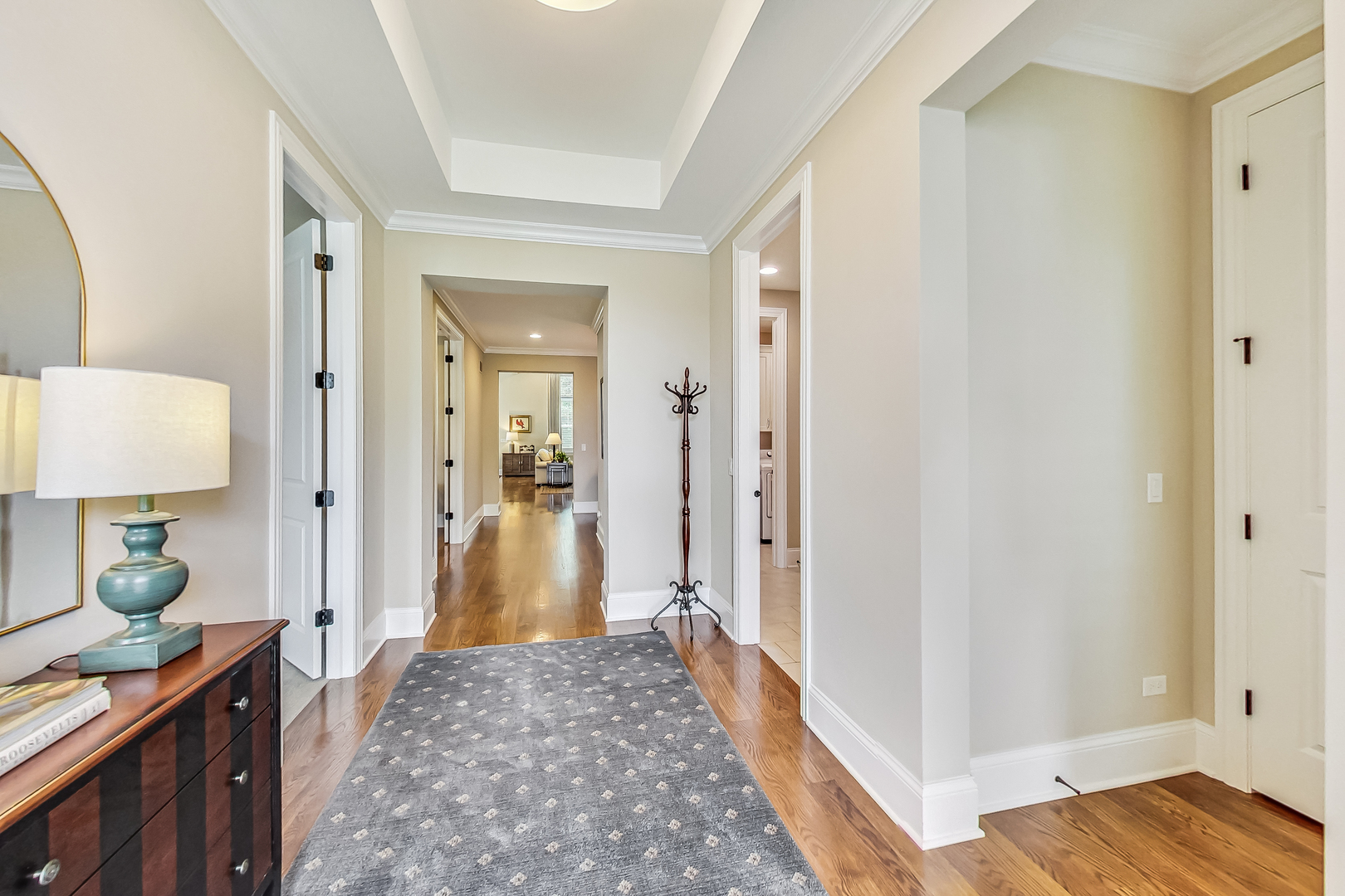 2811 Parkside Circle Glenview, IL 60026 - Photo 4 of 42 a view of a hallway with bathroom and wooden floor