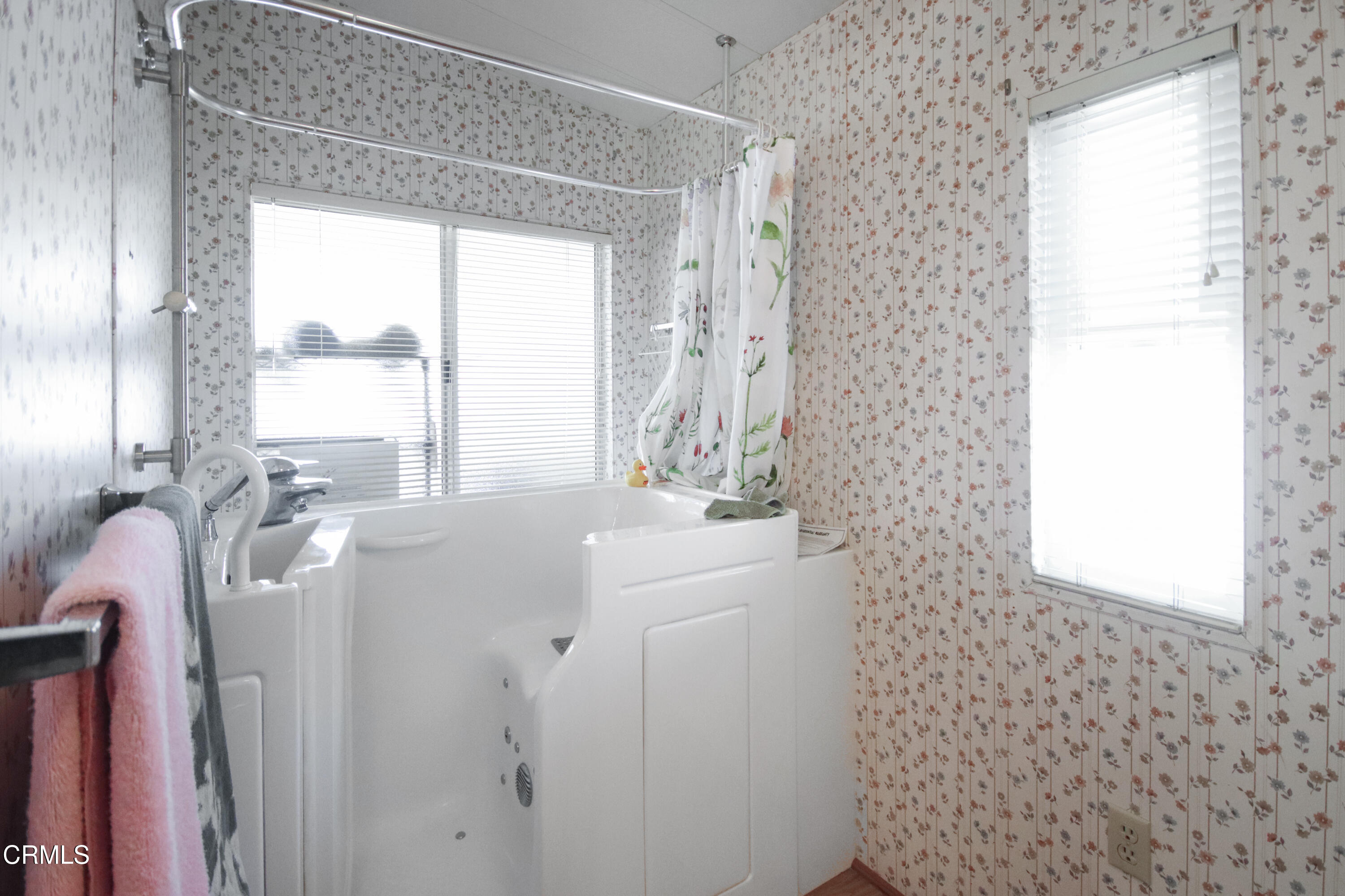 440 Dewberry Lane, Unit 105 Oxnard, CA 93036 - Photo 18 of 75 a en suite bathroom with a sink a mirror and a shower