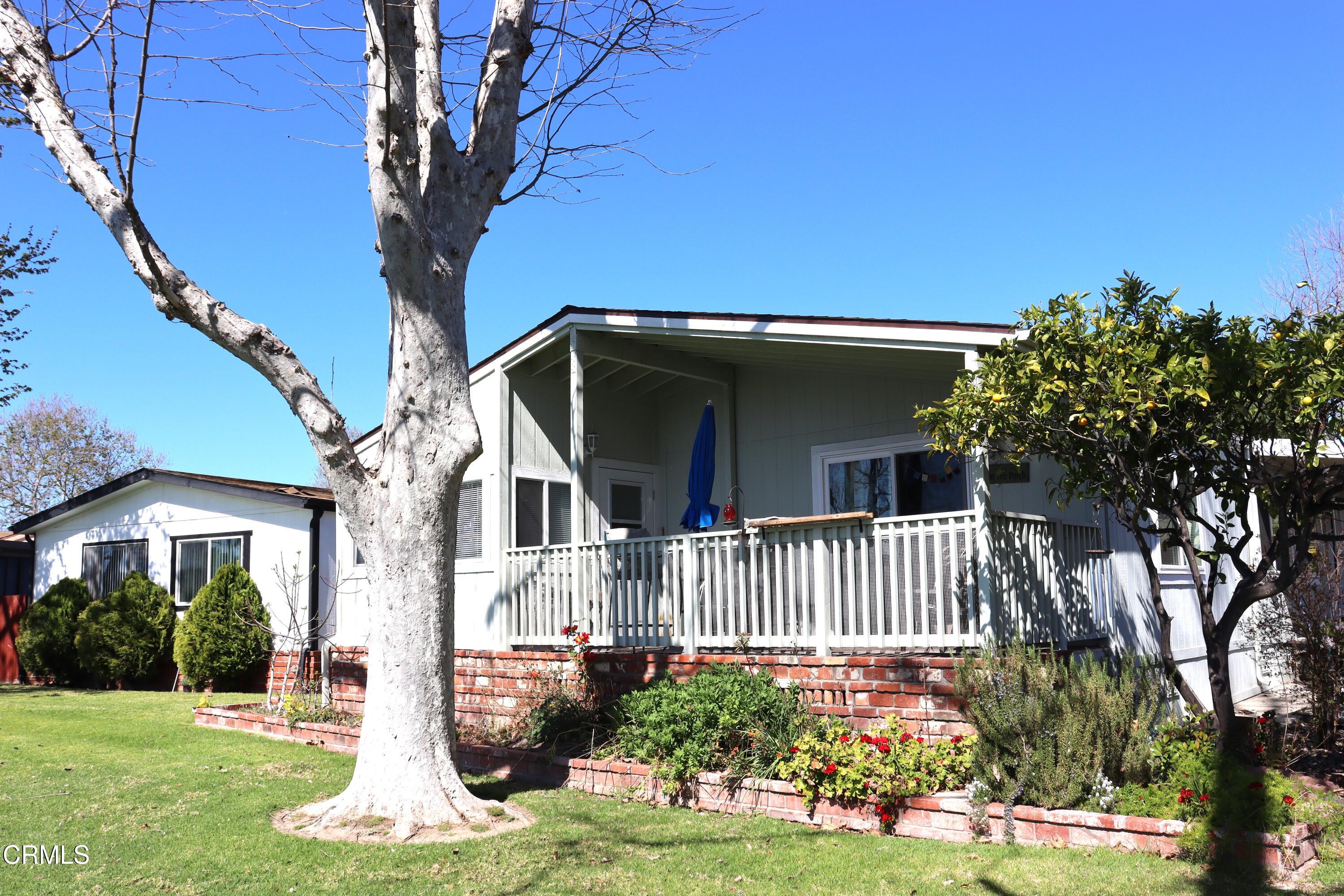 440 Dewberry Lane, Unit 105 Oxnard, CA 93036 - Photo 25 of 75 a front view of a house with a yard