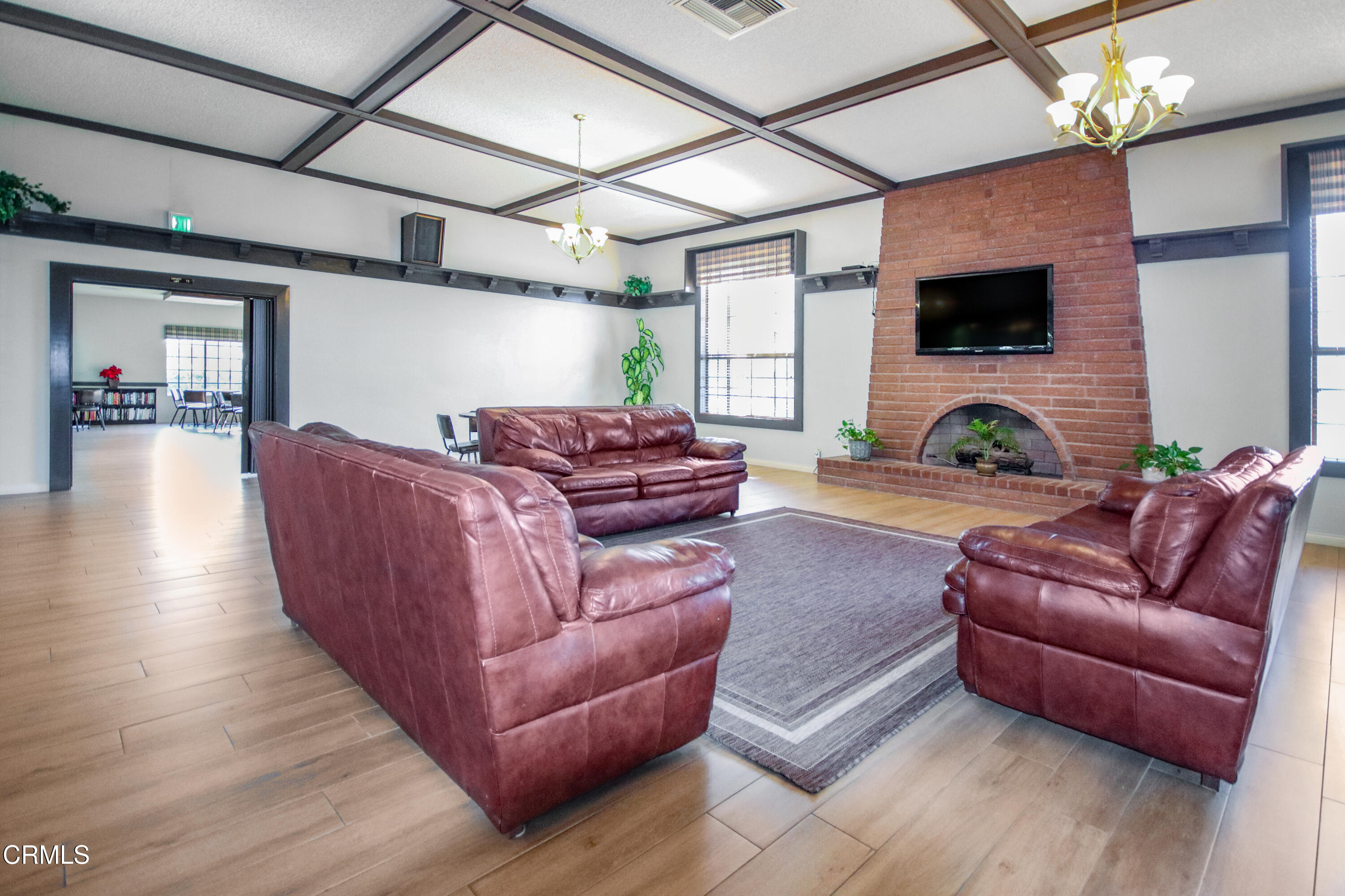 440 Dewberry Lane, Unit 105 Oxnard, CA 93036 - Photo 36 of 75 a living room with furniture a flat screen tv and a fireplace