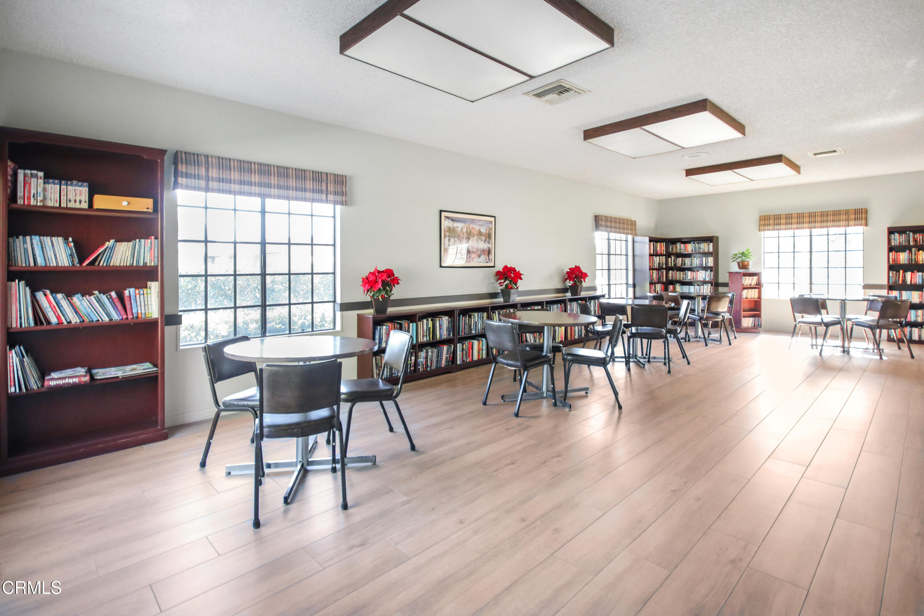 440 Dewberry Lane, Unit 105 Oxnard, CA 93036 - Photo 39 of 75 a view of a dining room with furniture and wooden floor