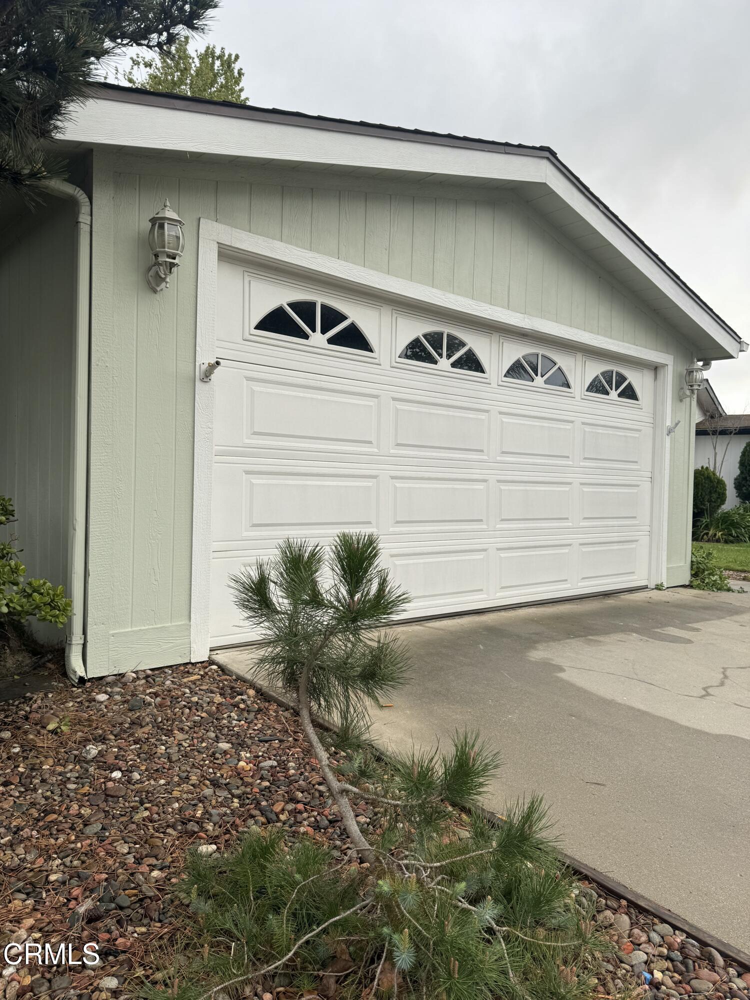 440 Dewberry Lane, Unit 105 Oxnard, CA 93036 - Photo 58 of 75 a front view of a house with a yard