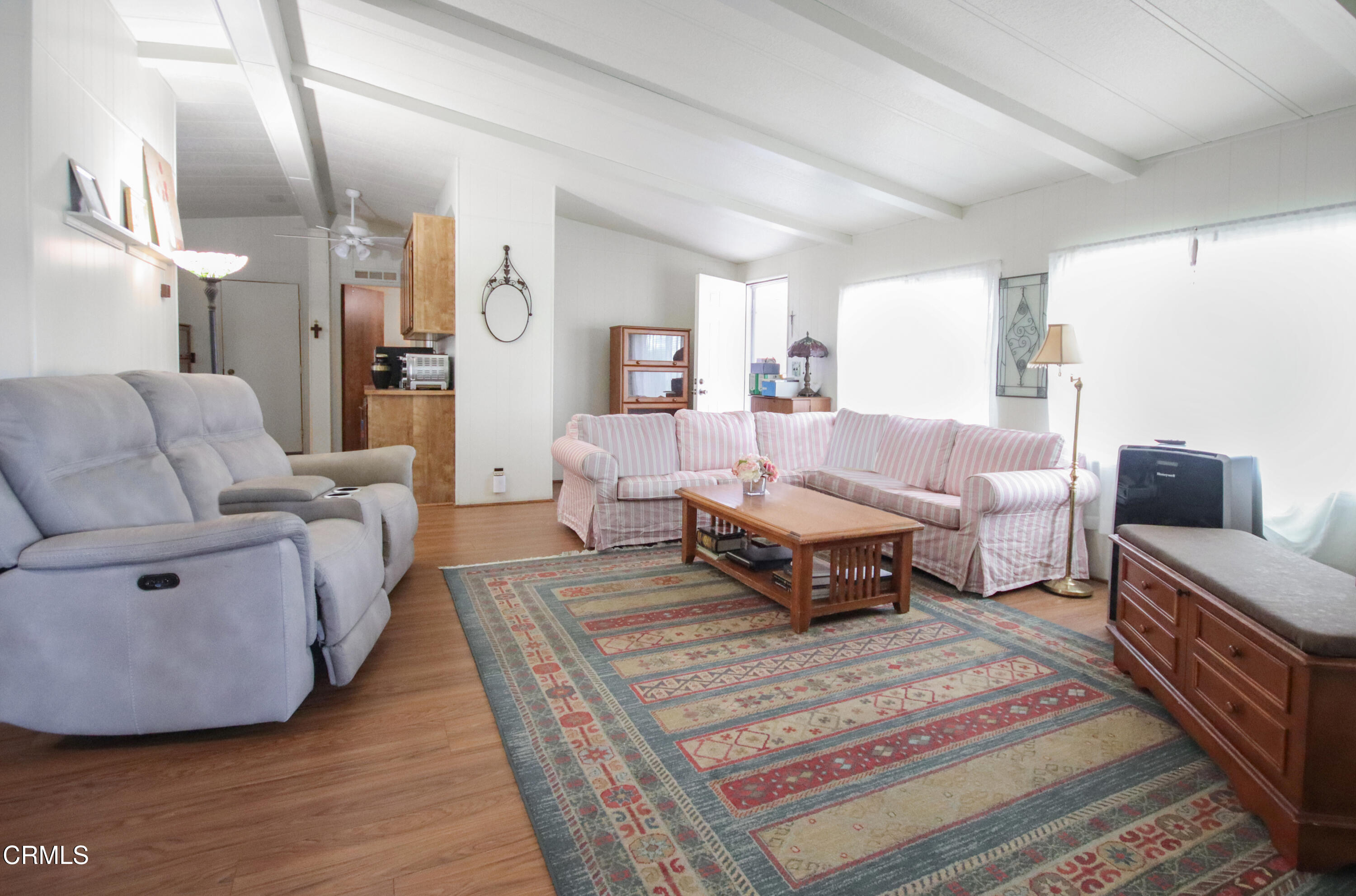 440 Dewberry Lane, Unit 105 Oxnard, CA 93036 - Photo 9 of 75 a living room with furniture and a rug