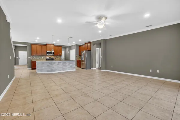 a view of a kitchen with a sink and cabinets