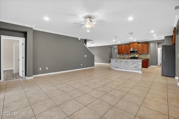 a view of a kitchen with a sink and cabinets