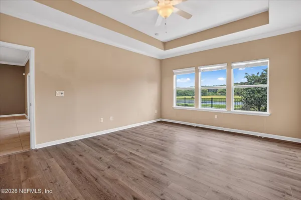 a bathroom with a double vanity sink a mirror and a bathtub