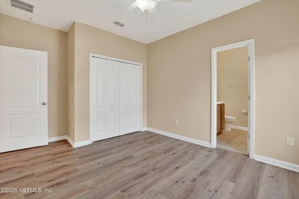 a bathroom with a sink vanity mirror and toilet