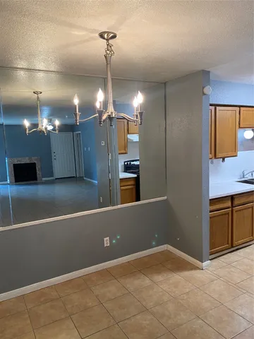 a view of a kitchen with a sink and cabinet