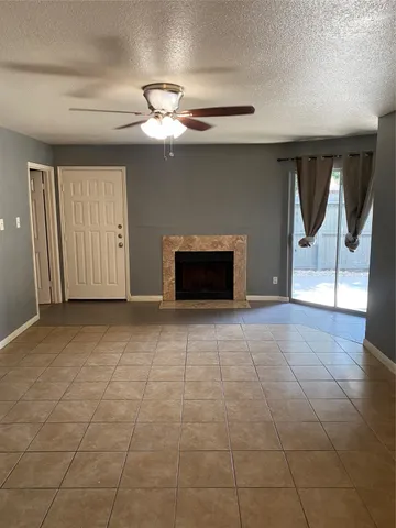 a view of an empty room with a fireplace