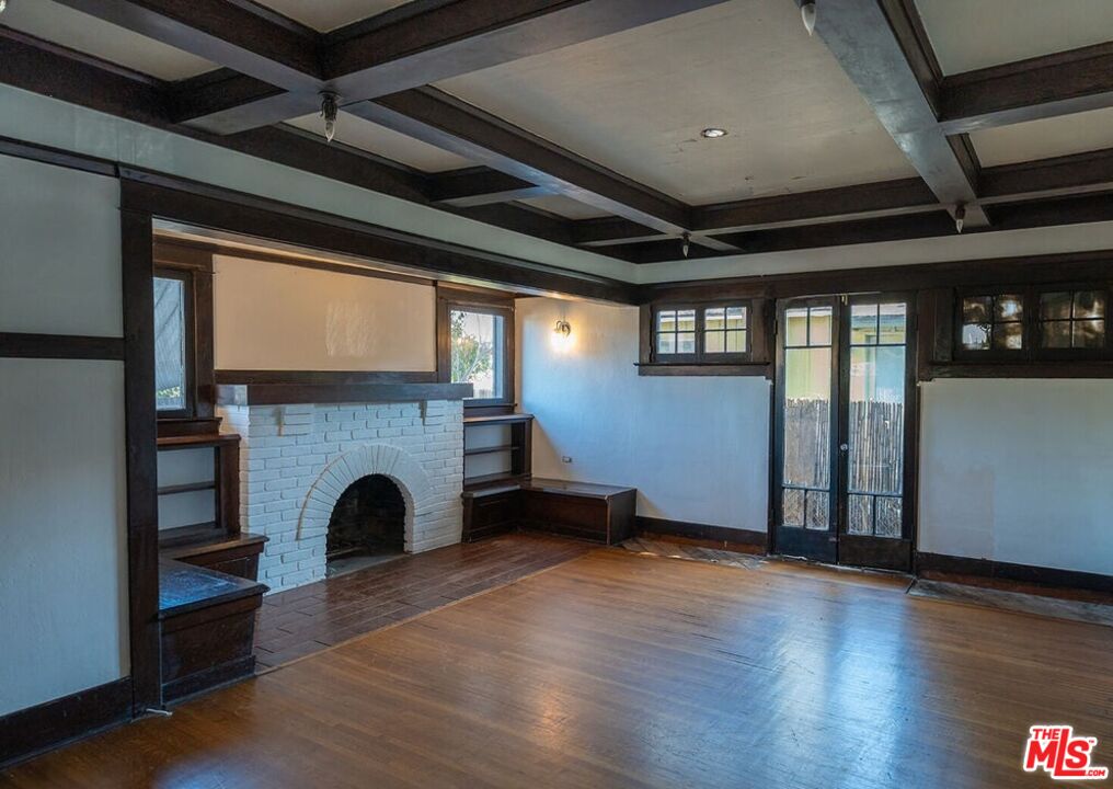 1801 Shell Avenue Venice, CA 90291 - Photo 1 of 12 a view of an empty room with wooden floor and a fireplace