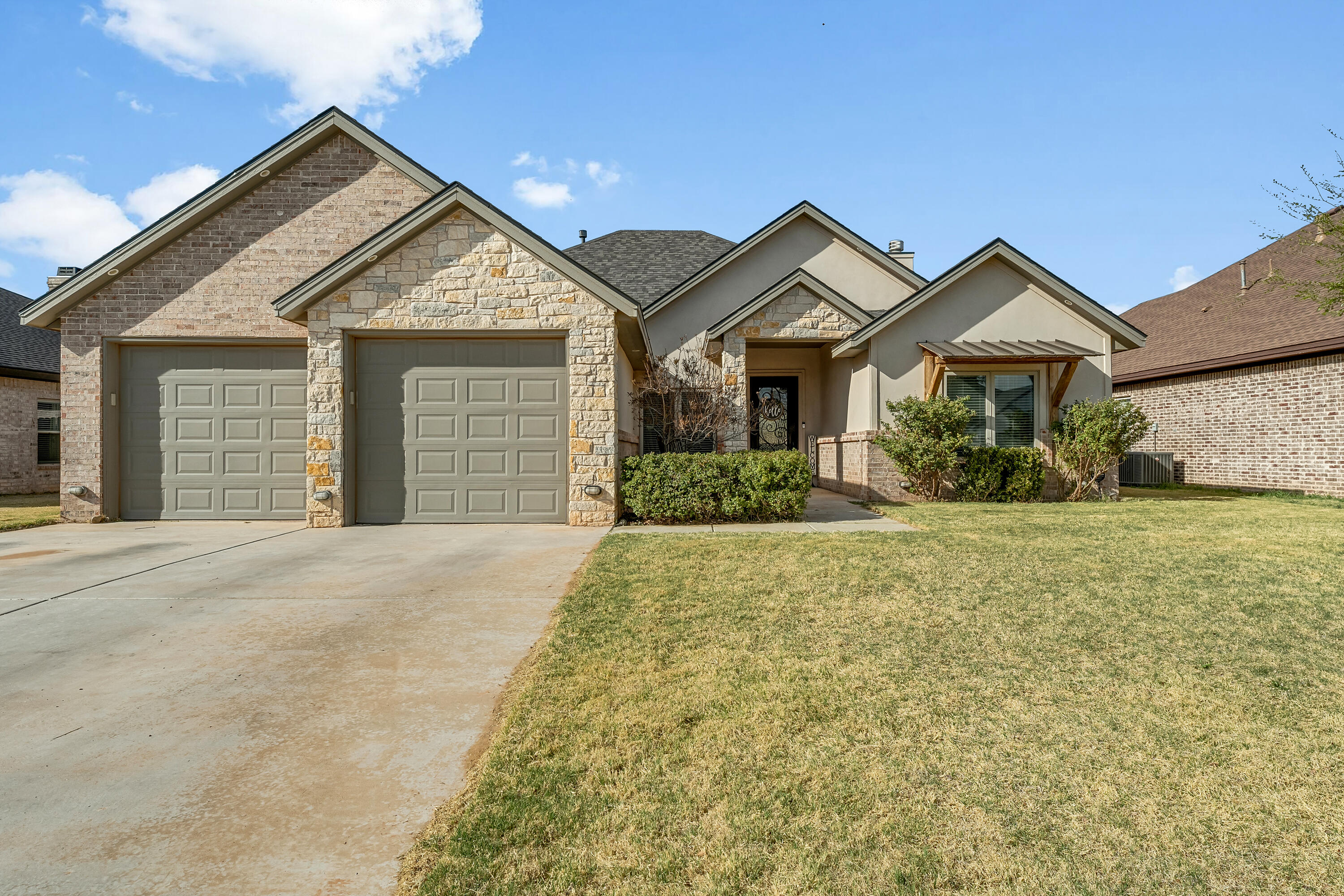 front view of a house with a yard