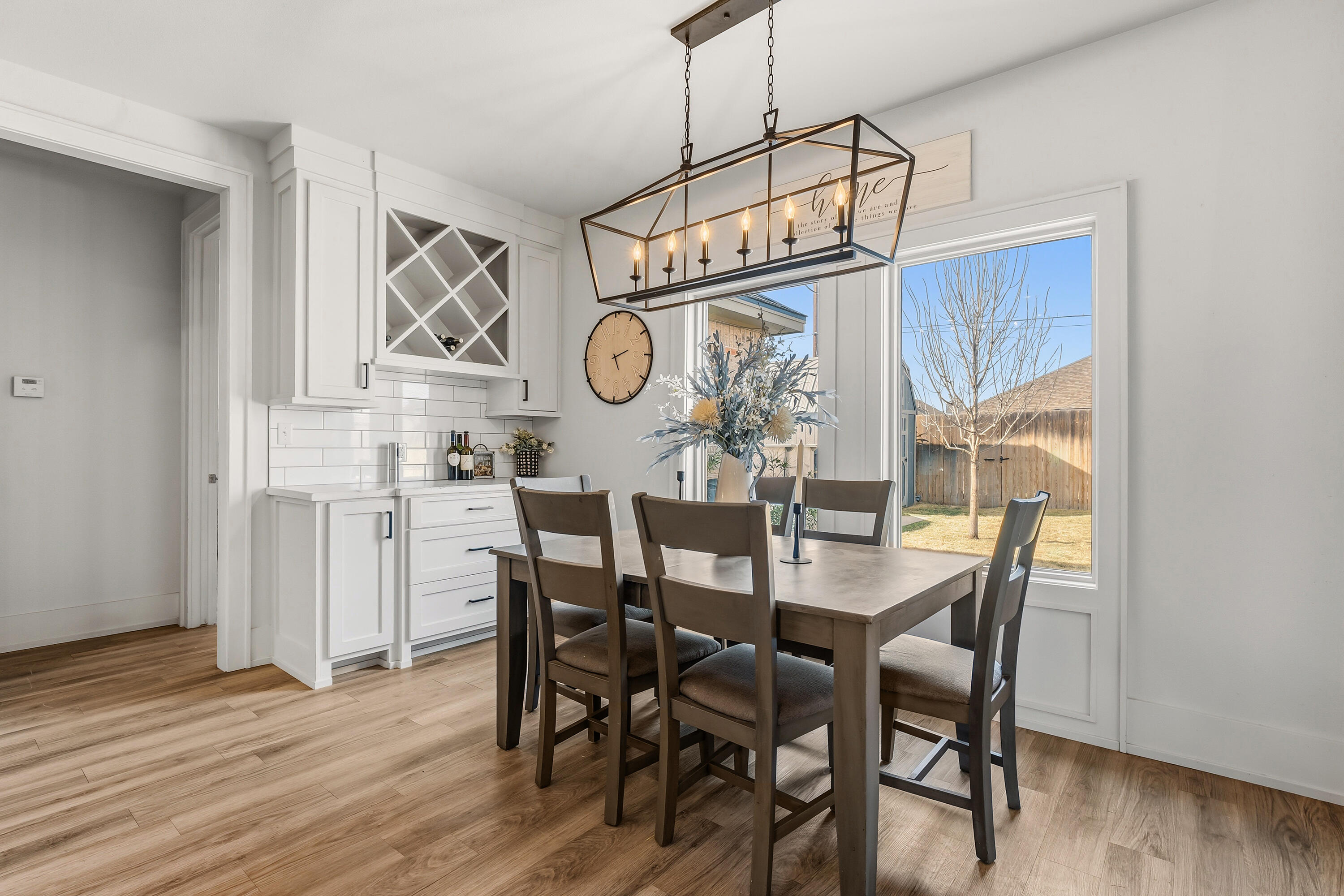 1113 16th Street Shallowater, TX 79363 - Photo 14 of 33 a view of a dining area with furniture and wooden floor