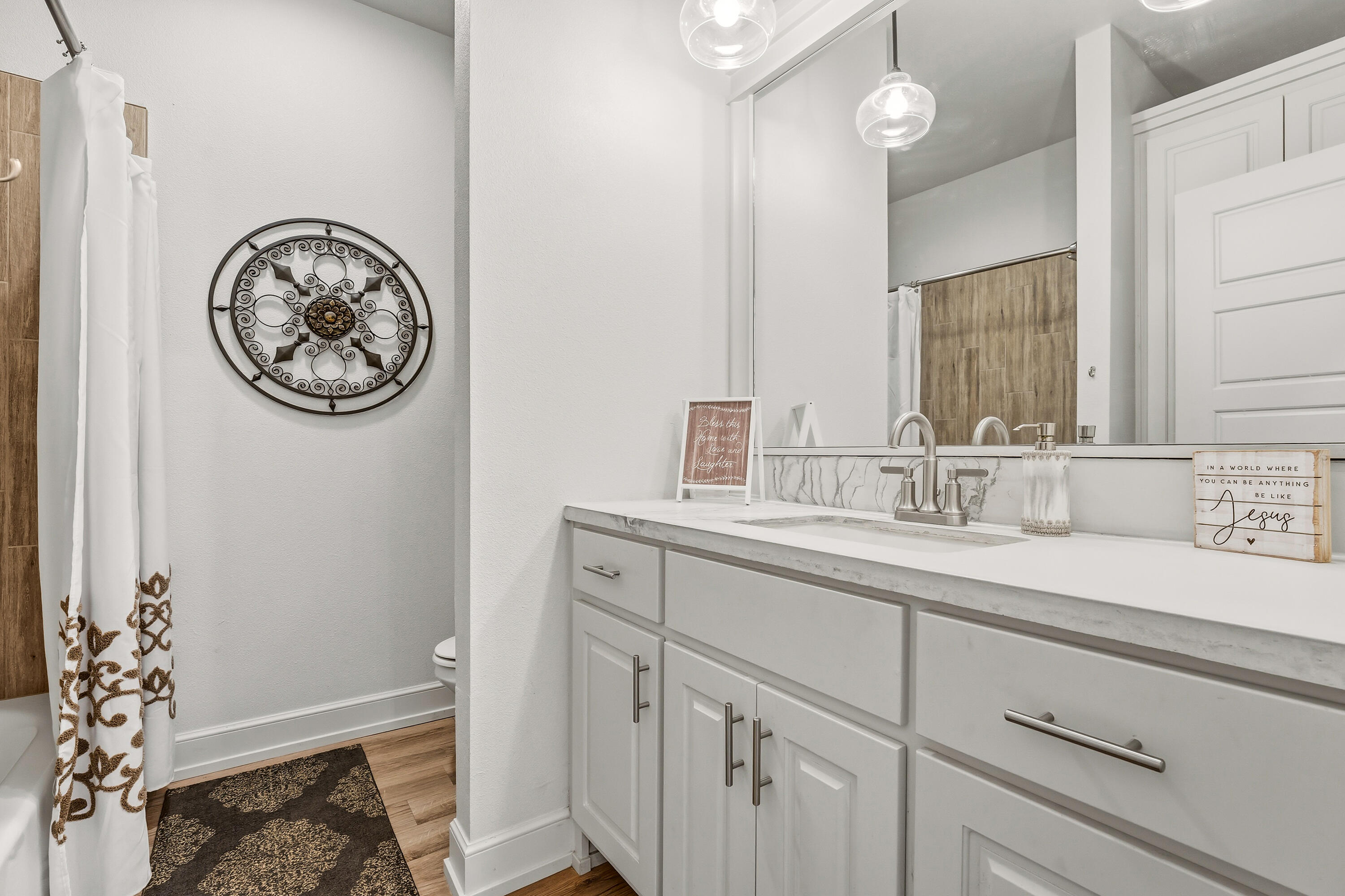 1113 16th Street Shallowater, TX 79363 - Photo 21 of 33 a bathroom with a sink and a mirror