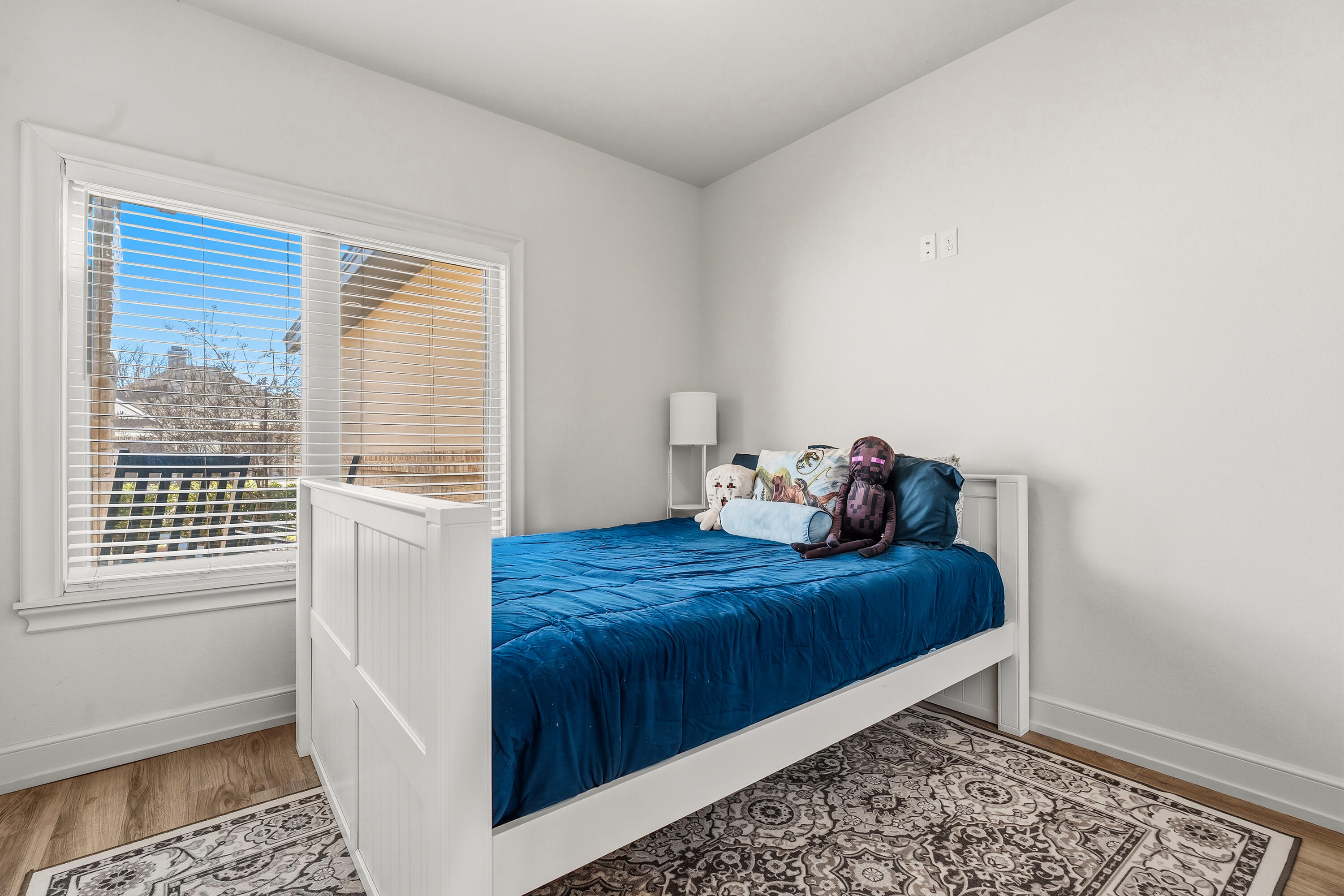 1113 16th Street Shallowater, TX 79363 - Photo 22 of 33 a bedroom with a bed and a window
