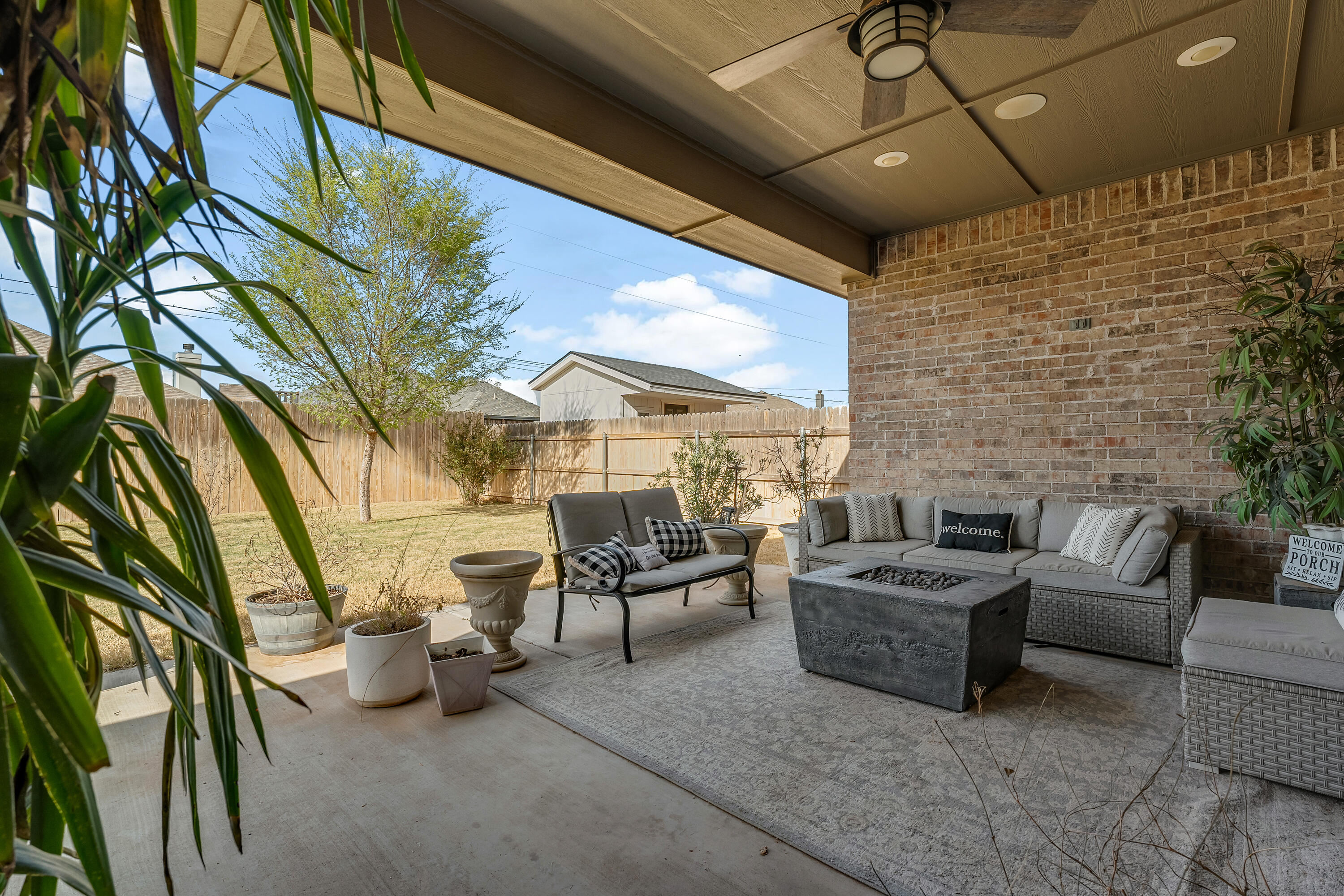 1113 16th Street Shallowater, TX 79363 - Photo 28 of 33 a outdoor living space with patio furniture and a fireplace