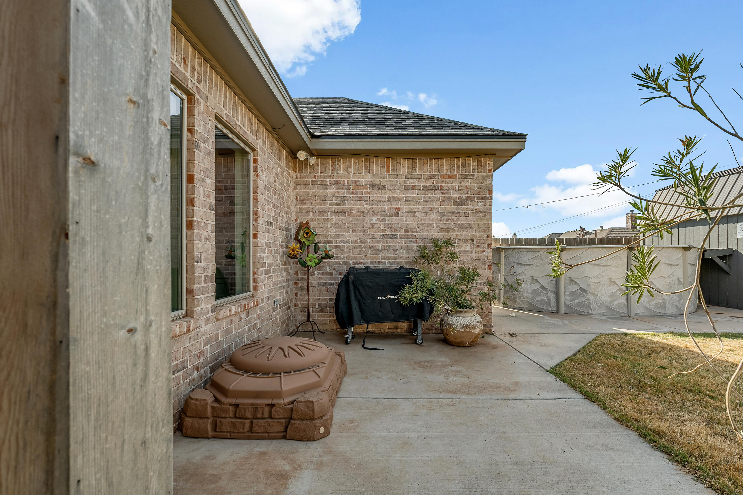 1113 16th Street Shallowater, TX 79363 - Photo 30 of 33 a view of a porch with furniture and a fire pit