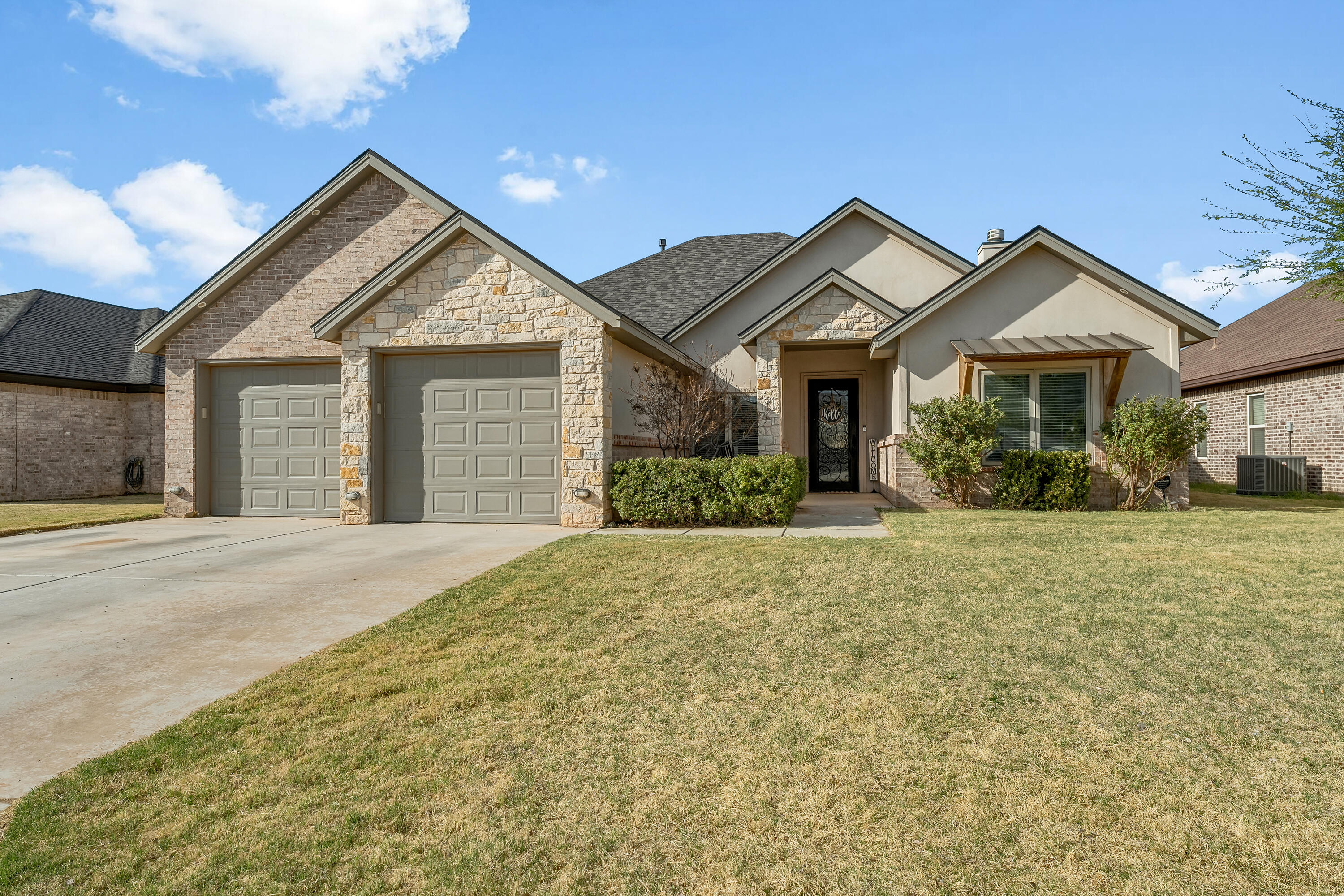 1113 16th Street Shallowater, TX 79363 - Photo 33 of 33 a front view of a house with a yard and garage