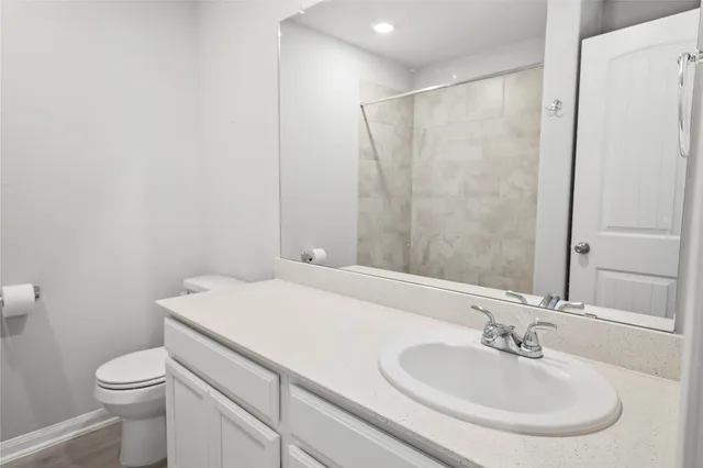 a bathroom with a sink vanity and a mirror
