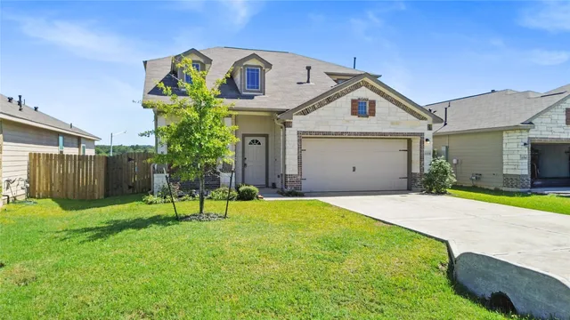 a view of a backyard with a small cabin and furniture