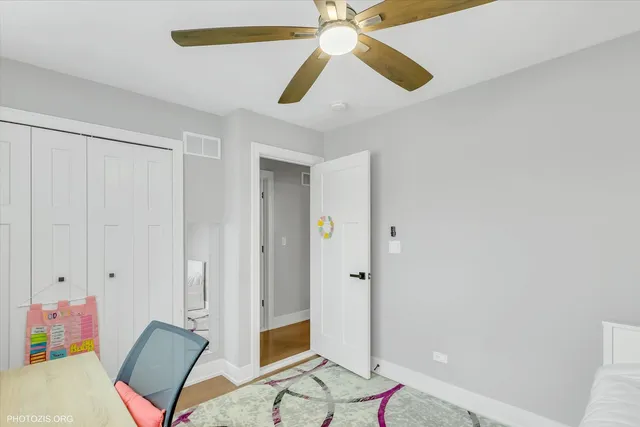 a bathroom with a sink a toilet and a window