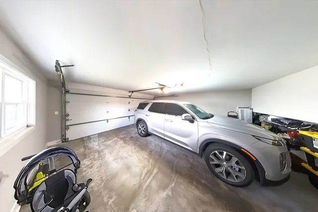 a view of a house with a yard porch and tree