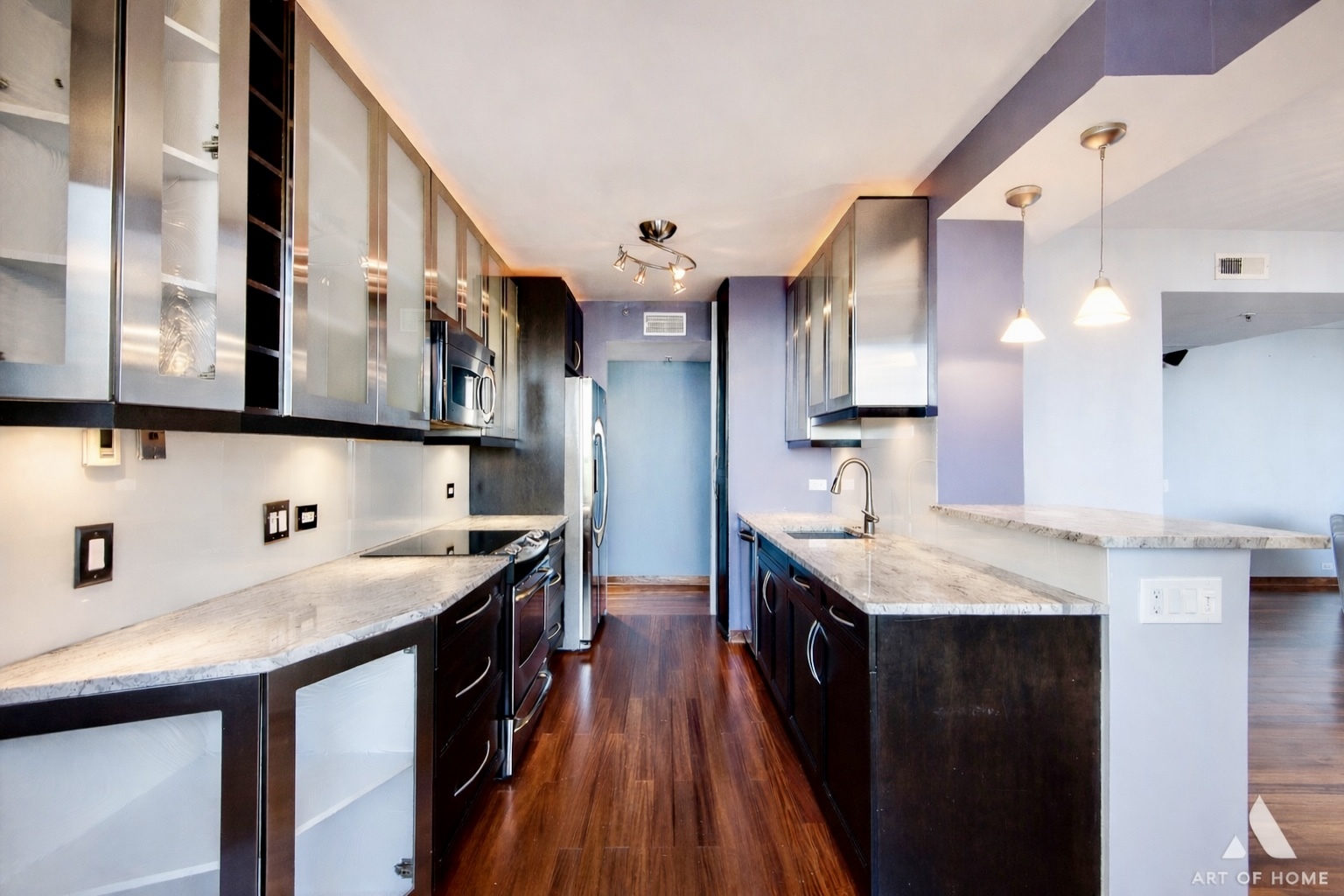 400 East Ohio Street, Unit 2902 Chicago, IL 60611 - Photo 12 of 33 a kitchen with stainless steel appliances granite countertop a sink a stove and a refrigerator