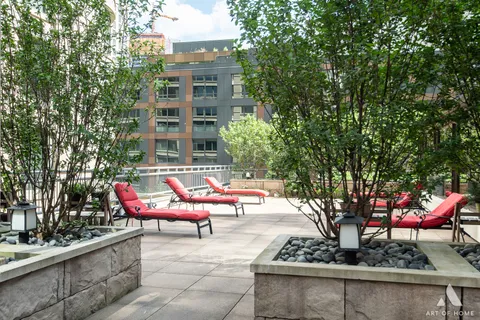 a view of a patio with couches and a table and chairs