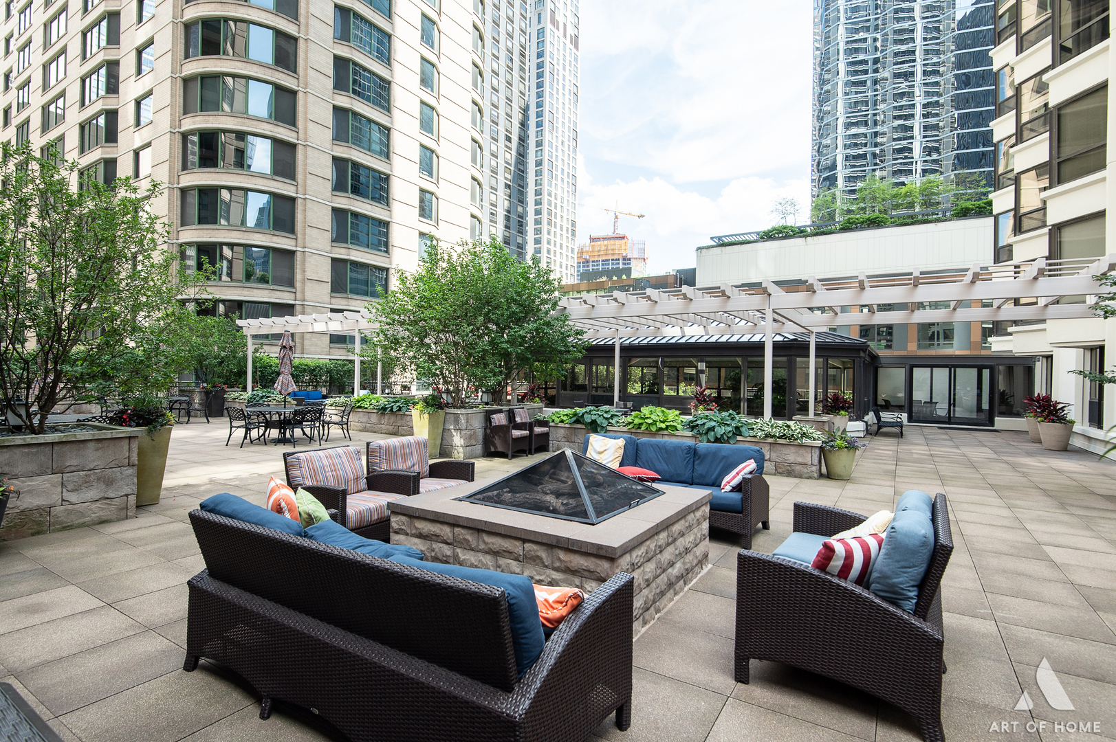 400 East Ohio Street, Unit 2902 Chicago, IL 60611 - Photo 27 of 33 a view of a patio with couches and a table and chairs
