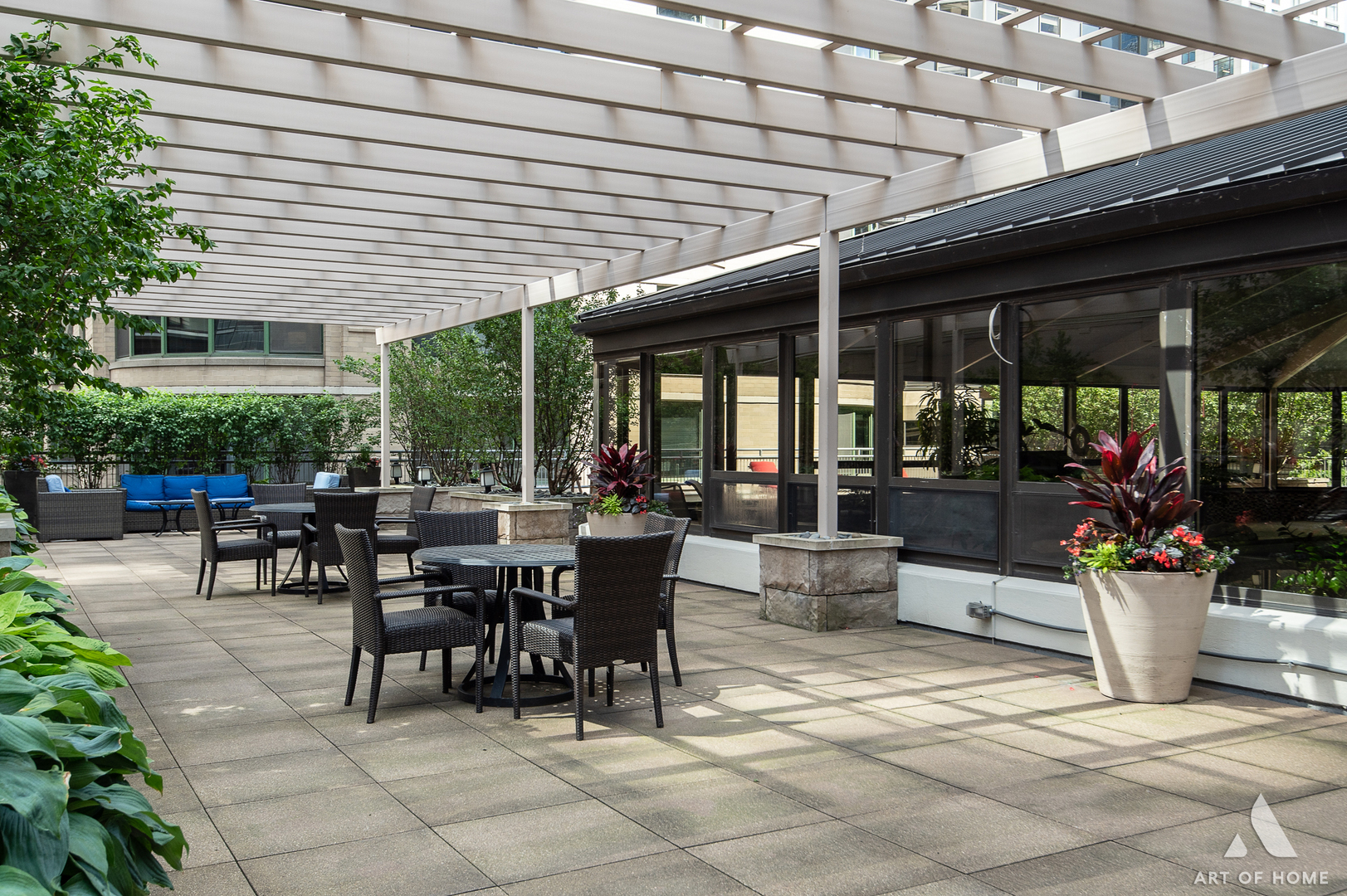 400 East Ohio Street, Unit 2902 Chicago, IL 60611 - Photo 28 of 33 a view of a patio with a dining table and chairs under an umbrella