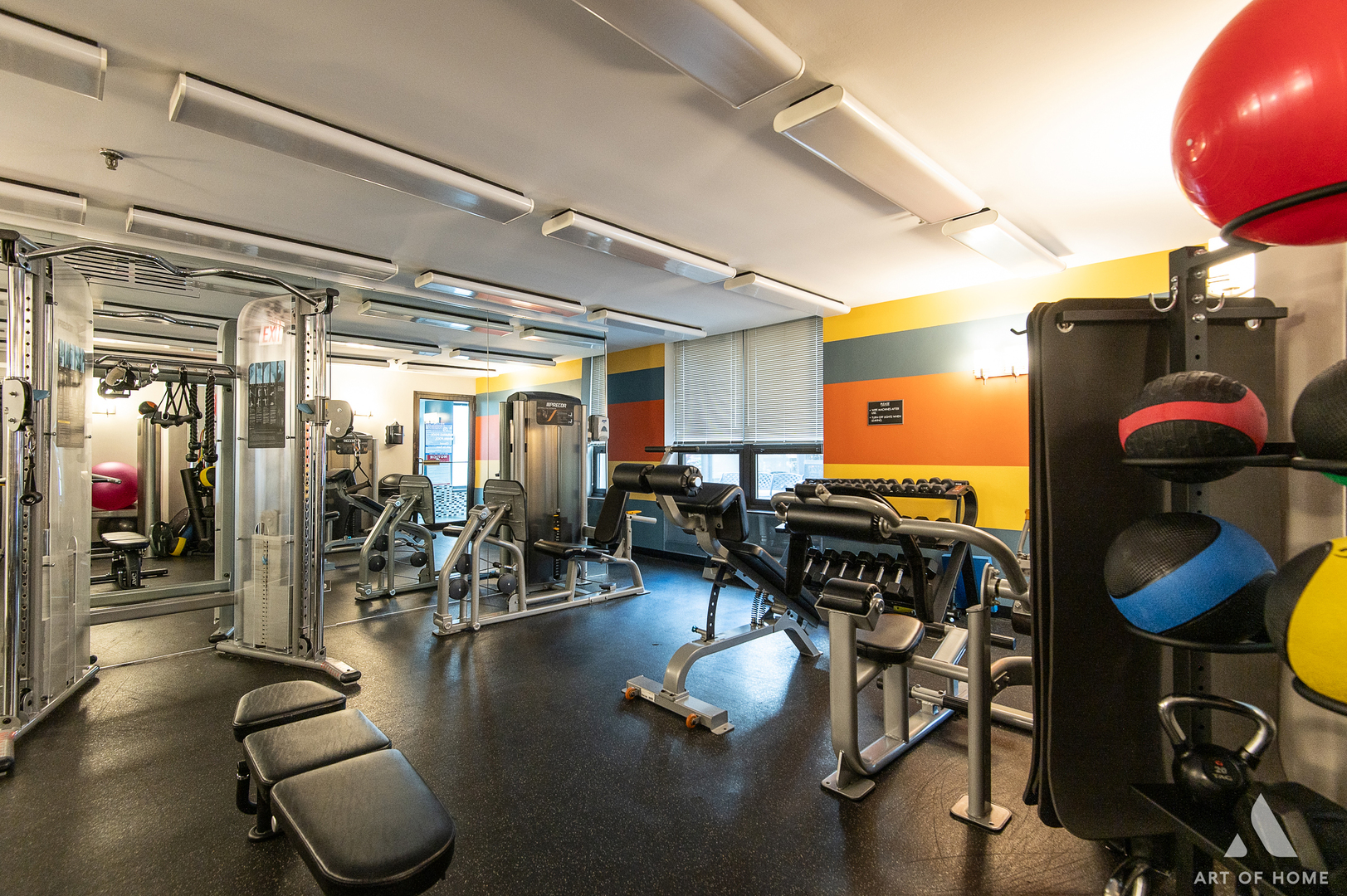 400 East Ohio Street, Unit 2902 Chicago, IL 60611 - Photo 30 of 33 a gym room with lots of chairs and mirrors