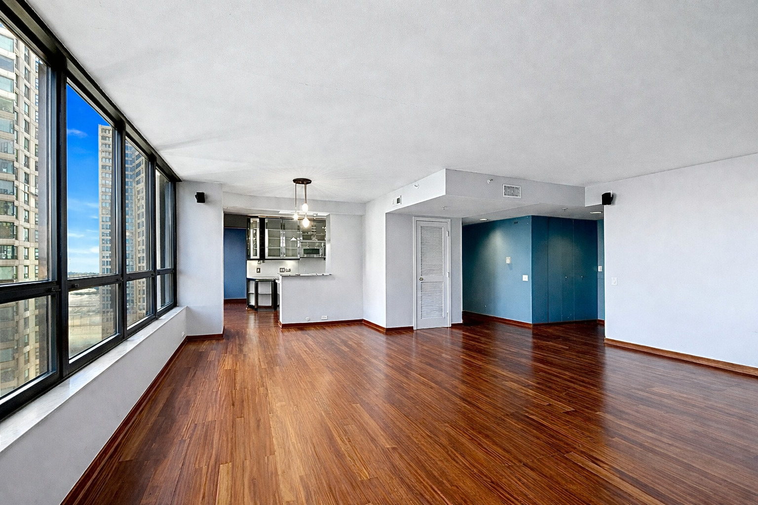 400 East Ohio Street, Unit 2902 Chicago, IL 60611 - Photo 7 of 33 a view of empty room with wooden floor and window