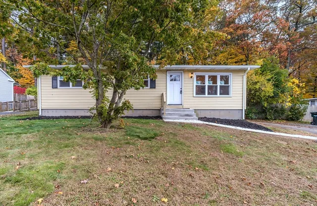 front view of a house with a yard