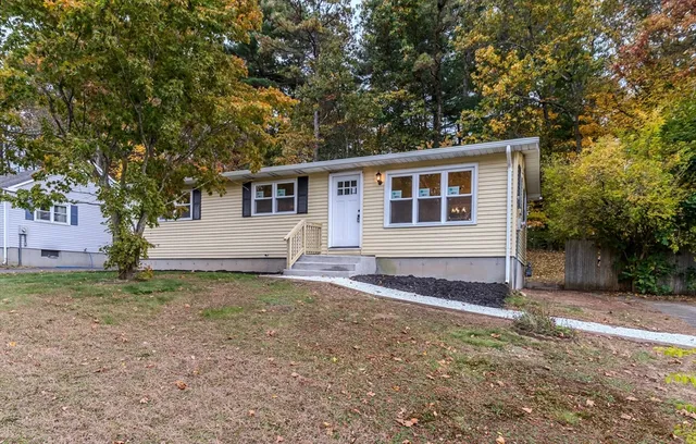 a house with trees in the background