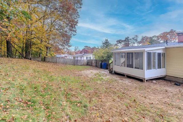 a view of a chair and table in the yard