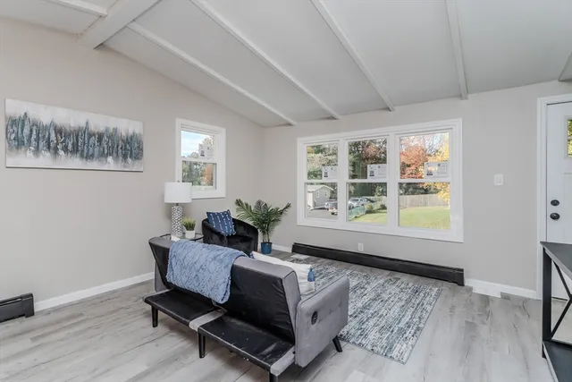 a living room with furniture and a window