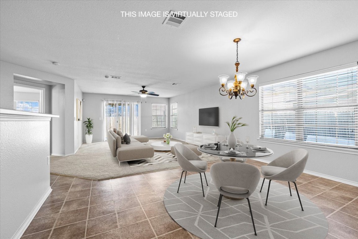 6507 Eudora Cove Austin, TX 78747 - Photo 1 of 1 a living room with furniture a chandelier and a chandelier