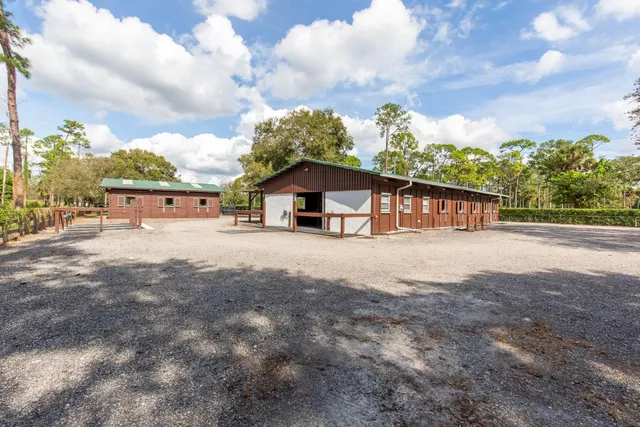 a view of a park with swings and slides