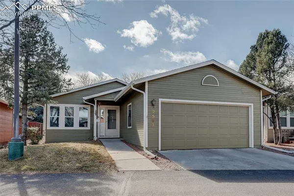 a front view of a house with a garage