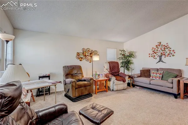 a living room with furniture and a couch