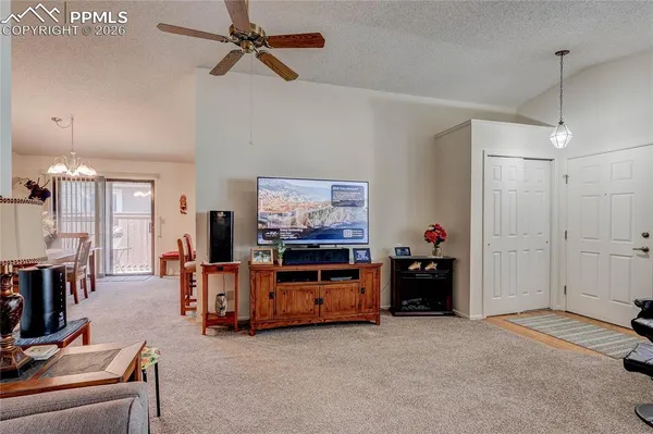 a view of a livingroom with furniture and a flat screen tv