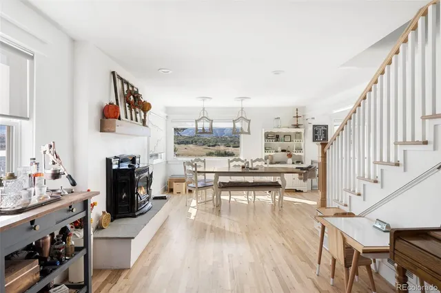 a living room with furniture and a kitchen view