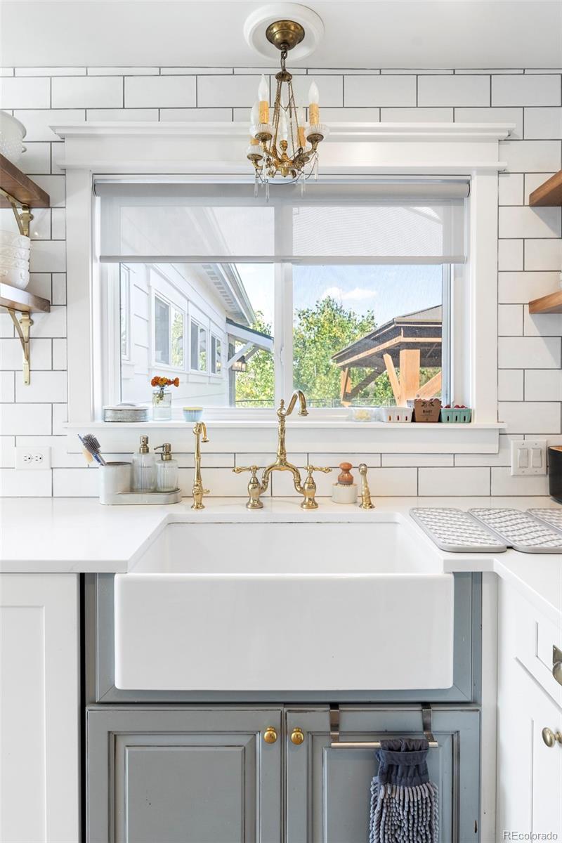 2073 South Perry Park Road Sedalia, CO 80135 - Photo 15 of 41 a kitchen with a sink and a window
