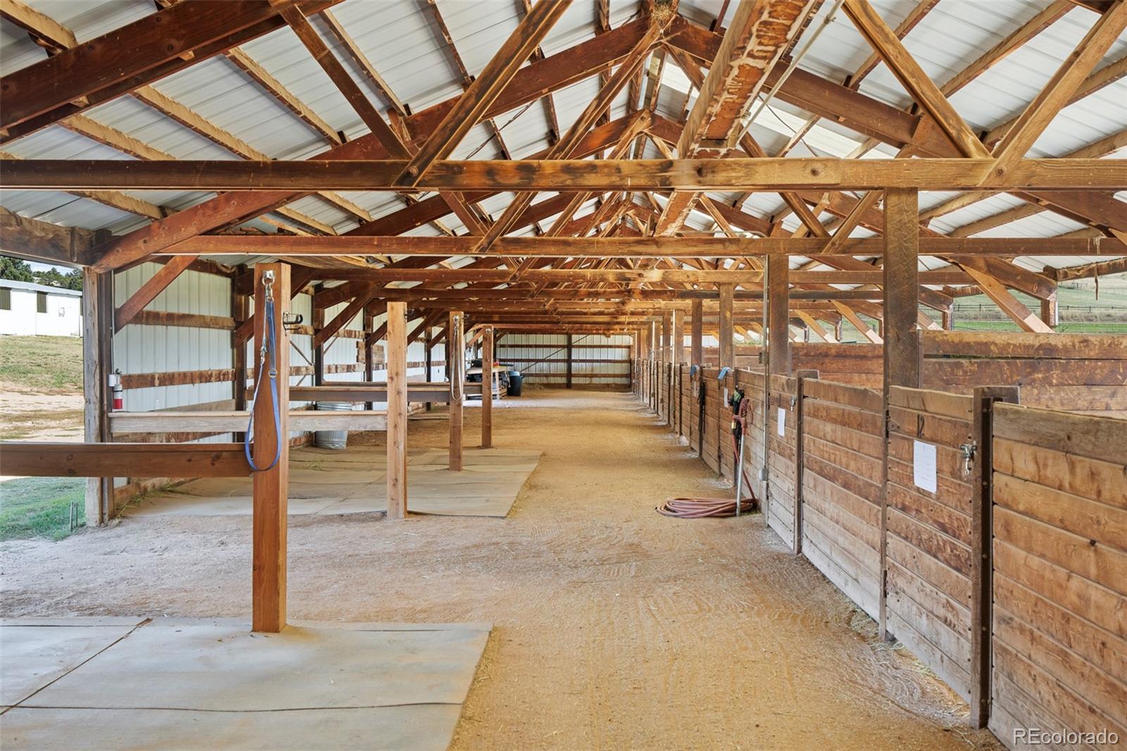 2073 South Perry Park Road Sedalia, CO 80135 - Photo 28 of 41 a view of a room with wooden floor