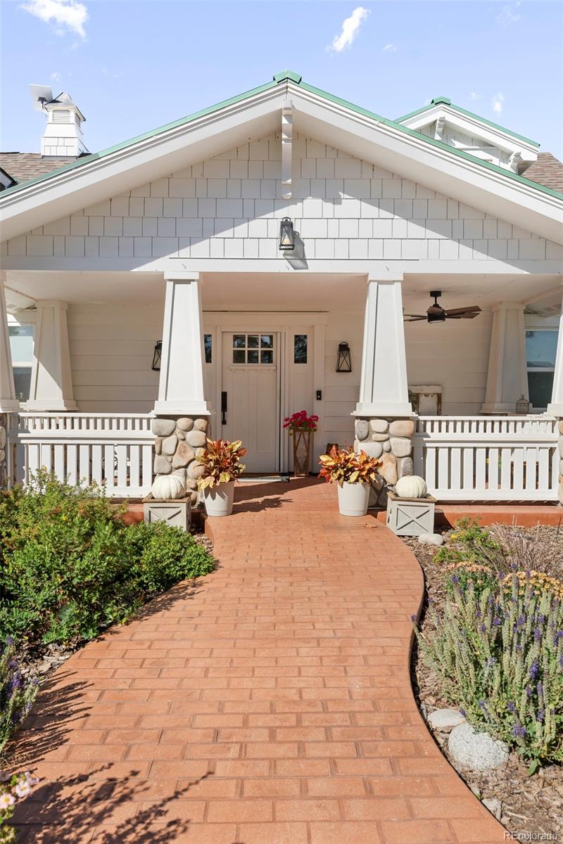 2073 South Perry Park Road Sedalia, CO 80135 - Photo 3 of 41 a view of a house with a patio