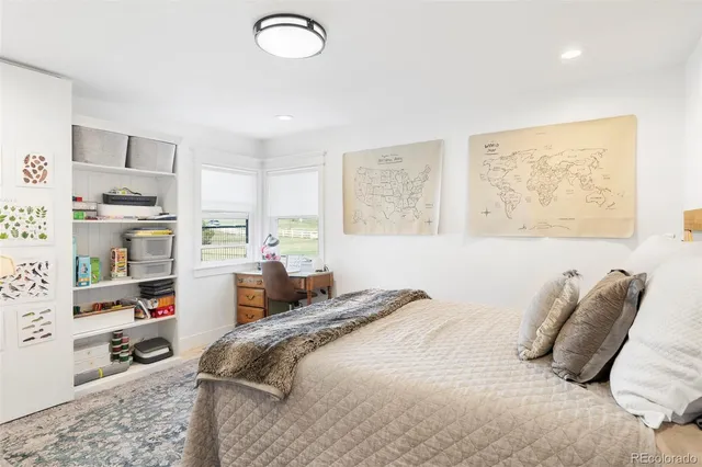 a bedroom with a bed and a cabinets